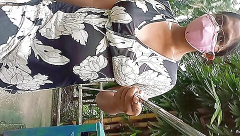 Amateur lady walks in the park and takes photos of her